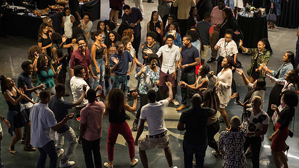 Students forming a dance circle at a Black Student Association event.