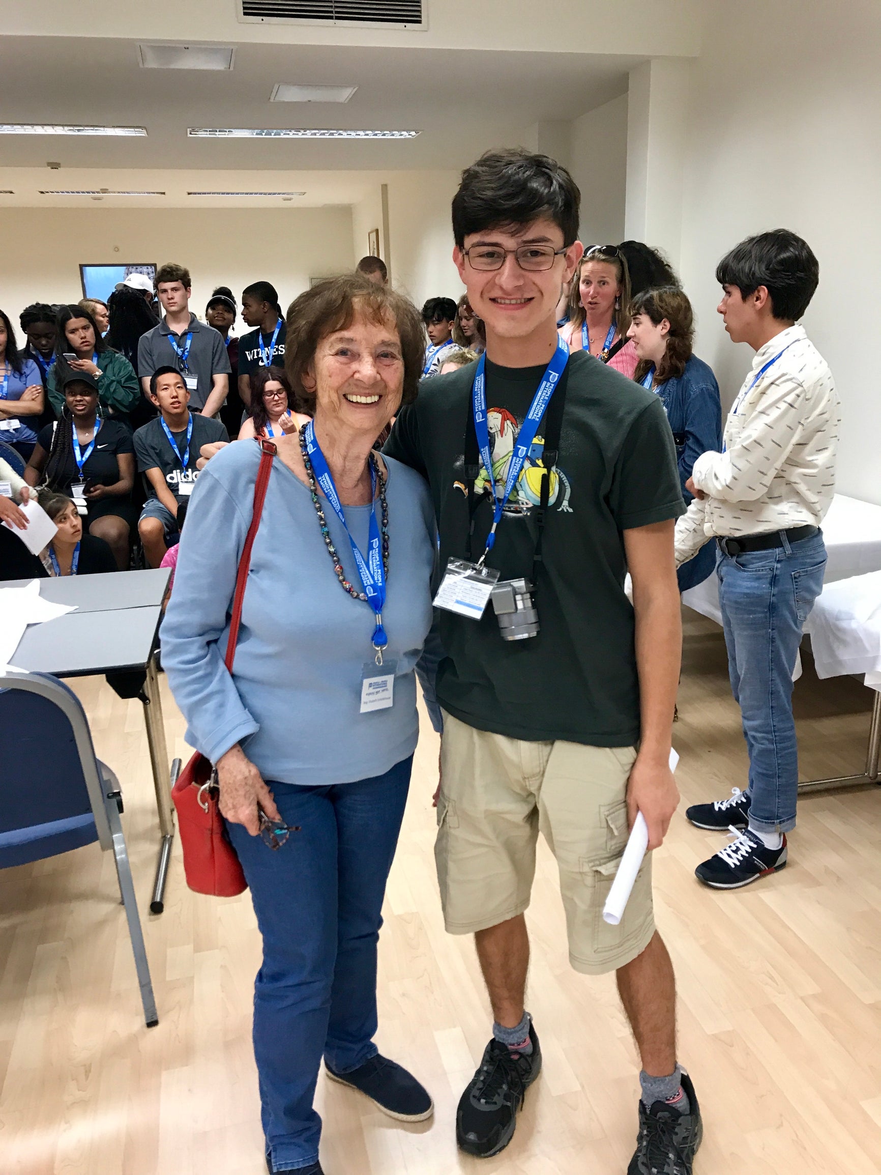 Xavier standing next to an older woman.