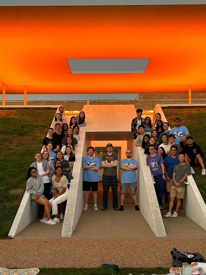 A group of Rice students soaking in the sunrise at the Skyspace!