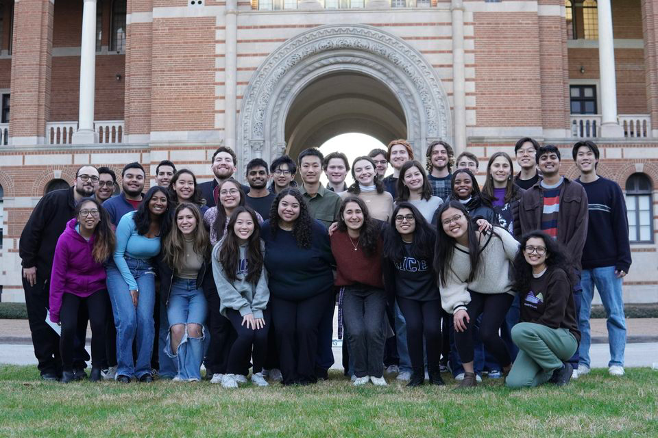 A group of Rice students in front of the sallyport at Lovett Hall.