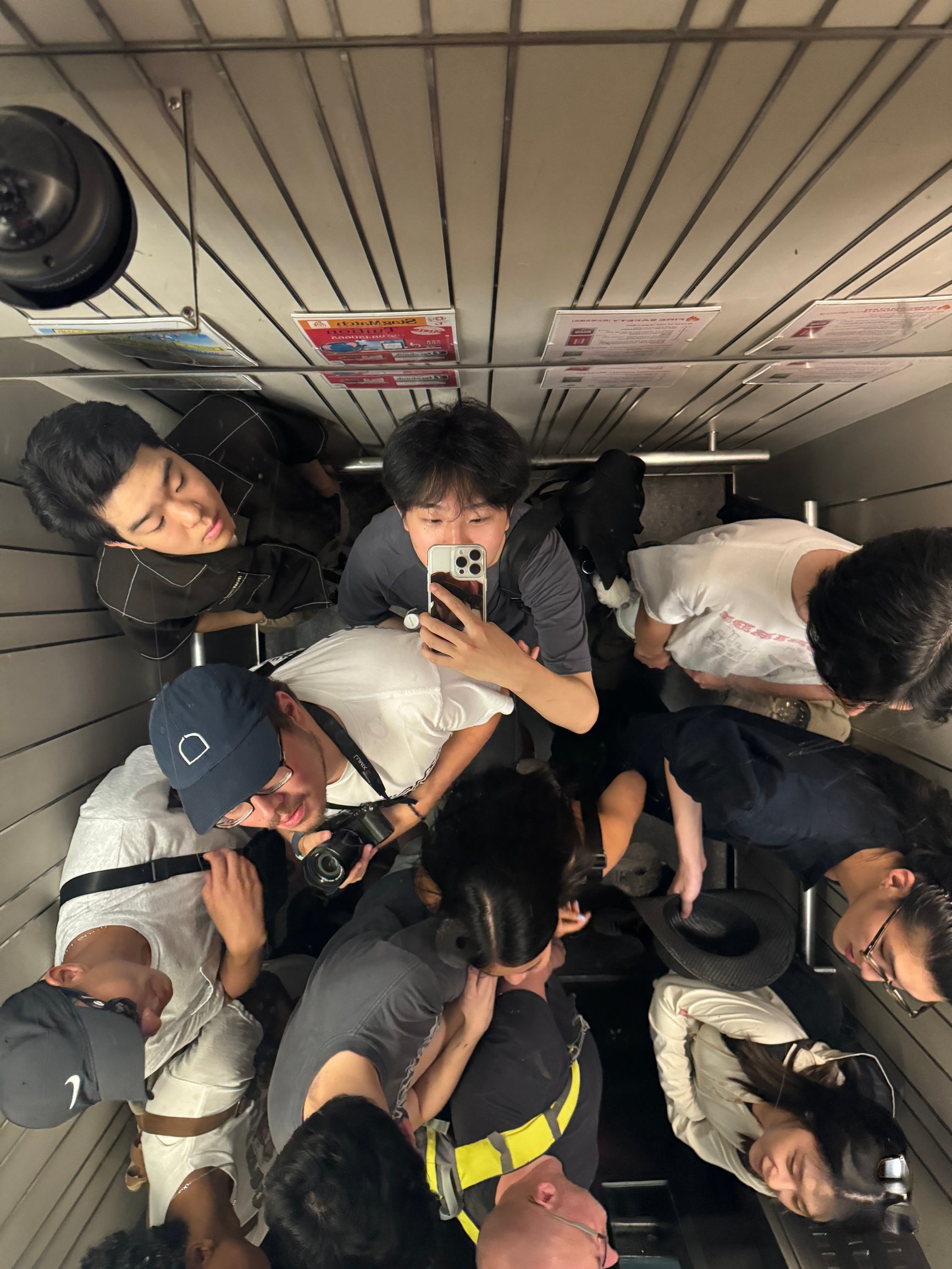 Jack taking an elevator selfie with other Rice classmates.