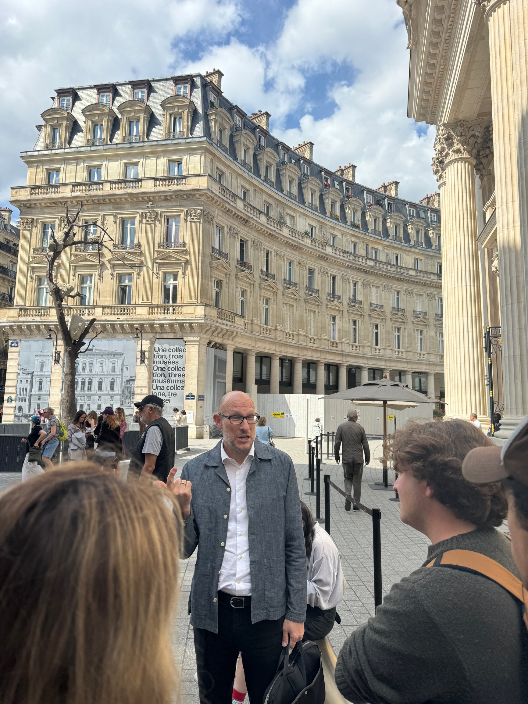 Students walking around in Paris with their professor.