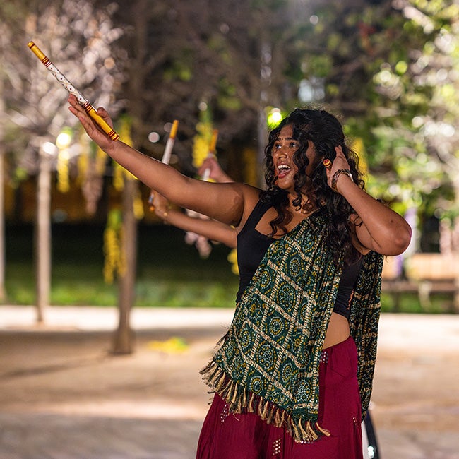 A Rice student performing a traditional Hindu stick dance during Diwali 