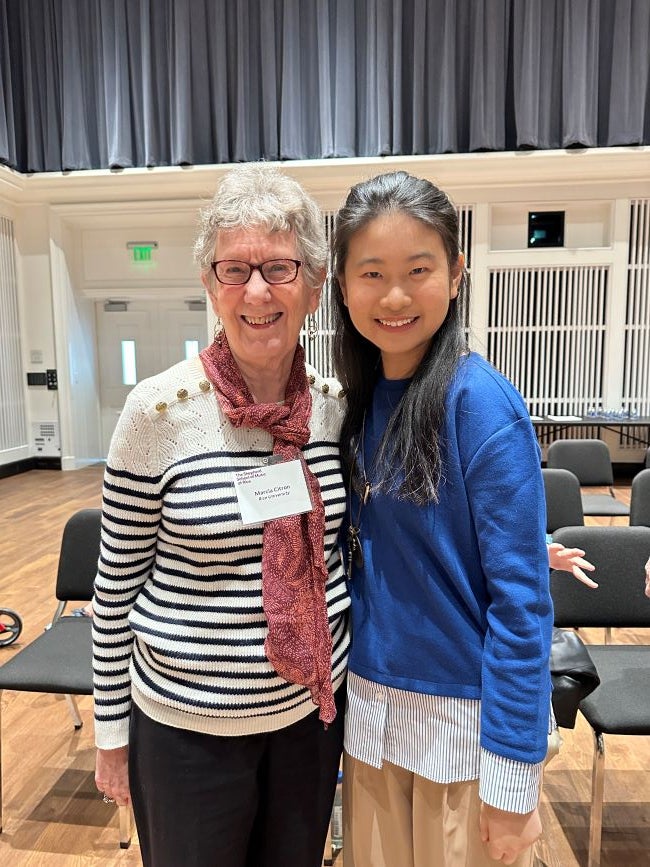 A Rice student posing with a former female professor 