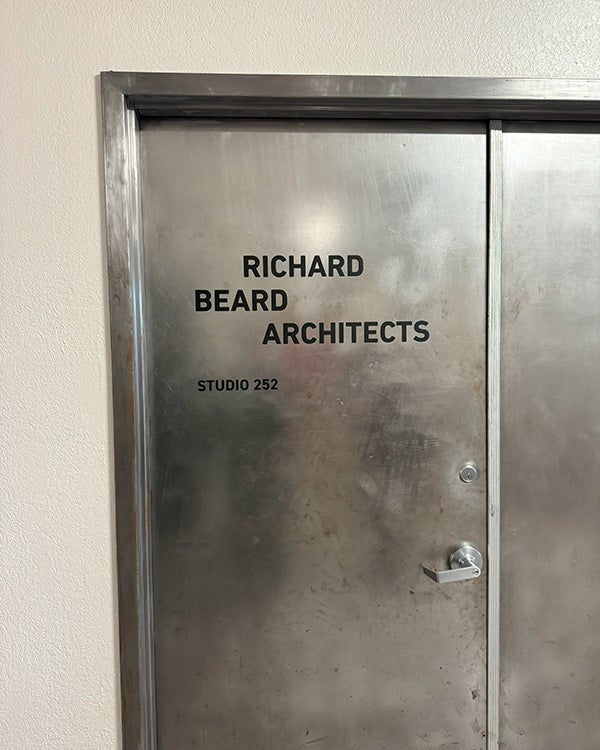 A metal door saying Richard Beard Architects 