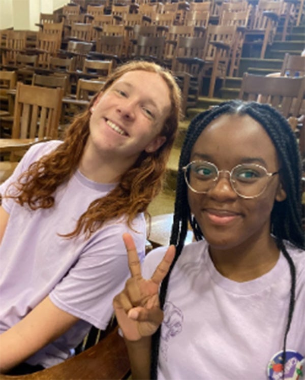 Two Rice students smiling.