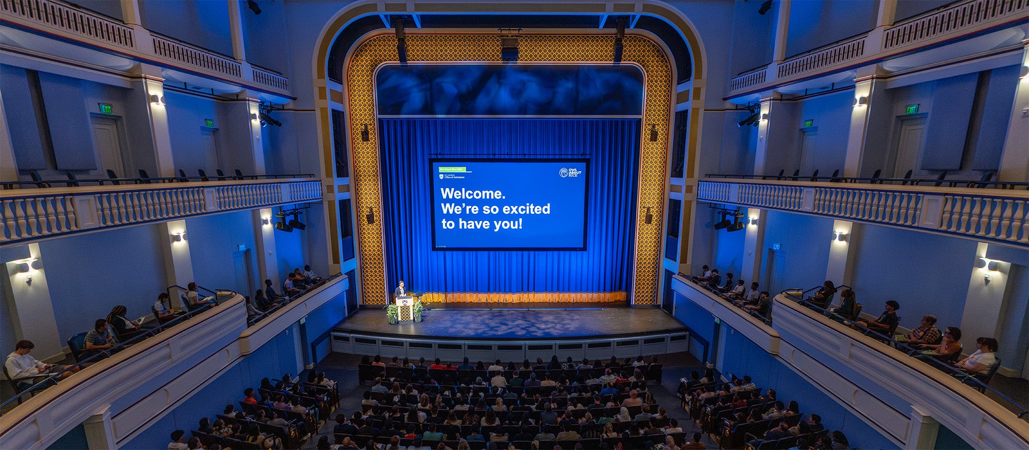 A photo of students listening to a presentation at Rice.