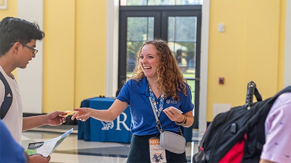 An admission counselor talking to a student.