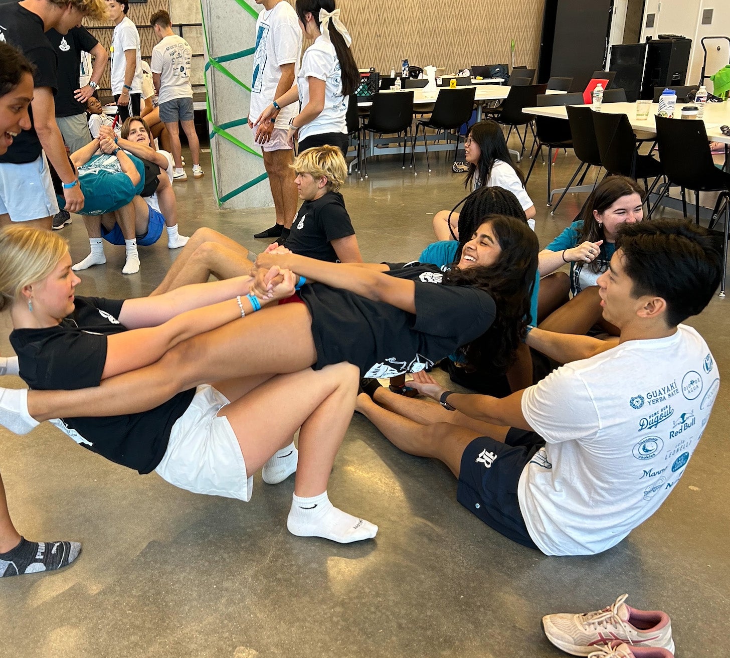 A photo of RHA advisors completing a team-building exercise together.