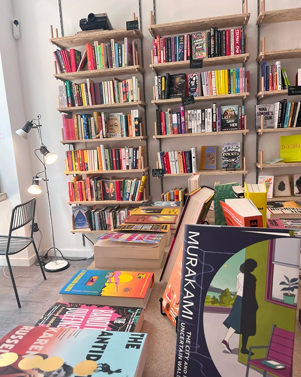 Bookshelves and tables with books at a bookstore in France