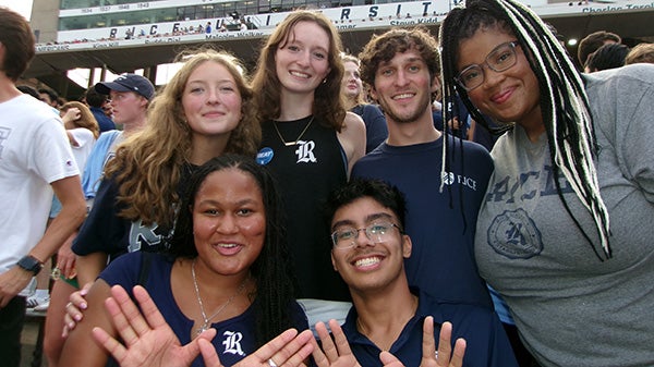 Students together in a sporting venue