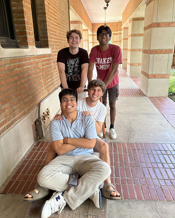 A group of male students in a hallway