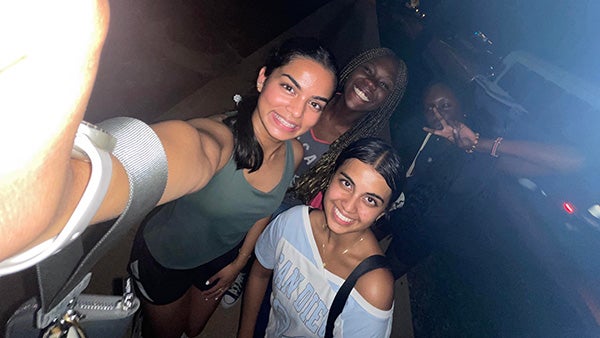 Sudents taking a selfie with flash