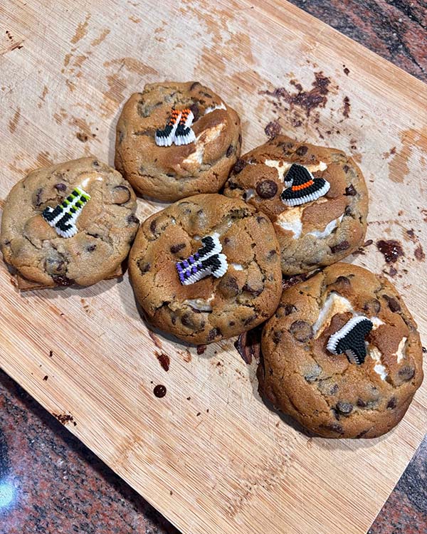 Cookies with Halloween-themed decorations on a wooden table