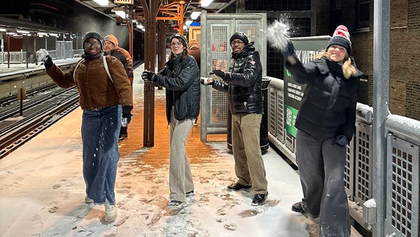 People throwing snowballs at the camera