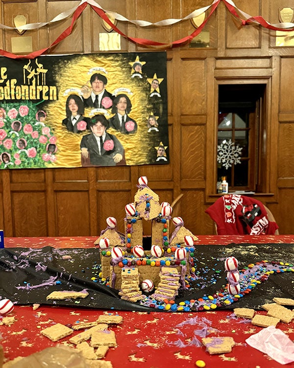 Gingerbread house in festively decorated hall