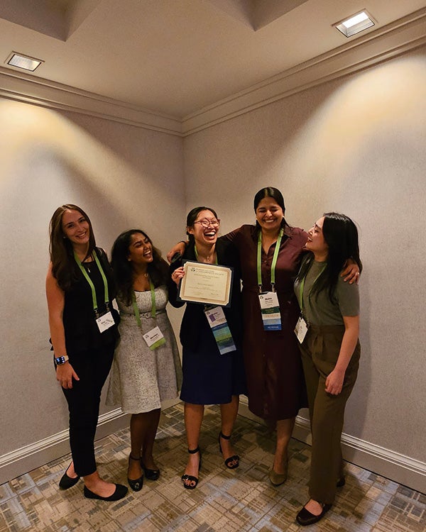 People laughing and hugging together