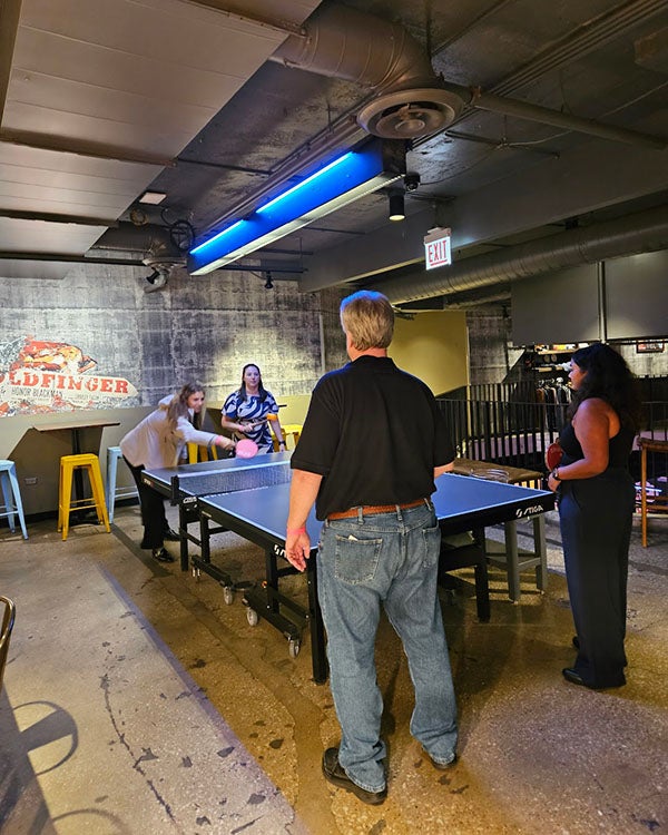 People playing table tennis