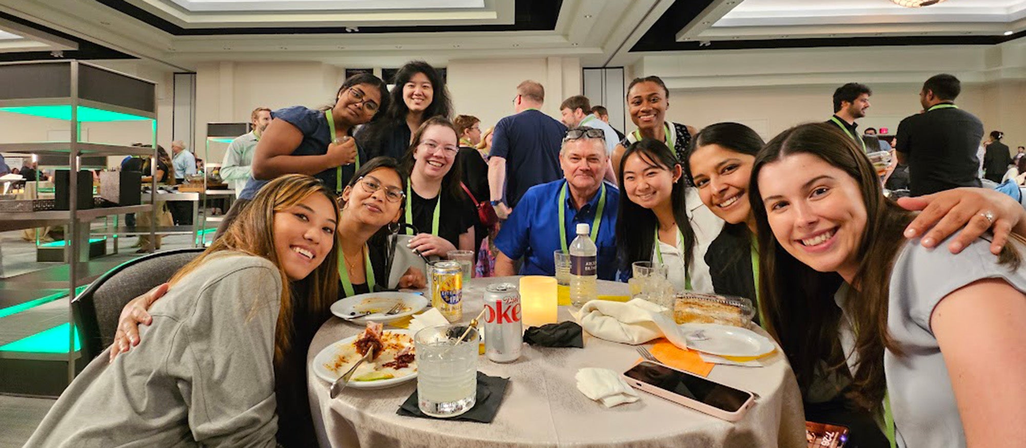 People huddled around a round table