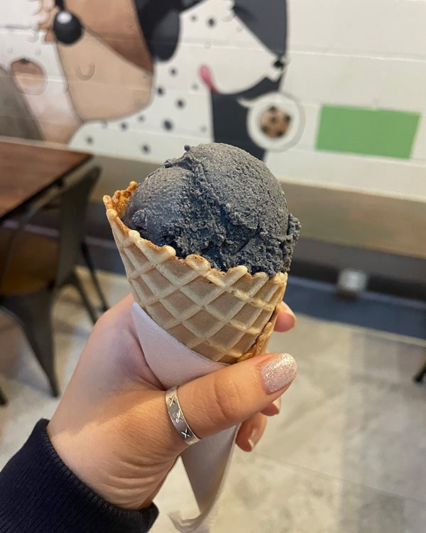 Black ice cream in a cone