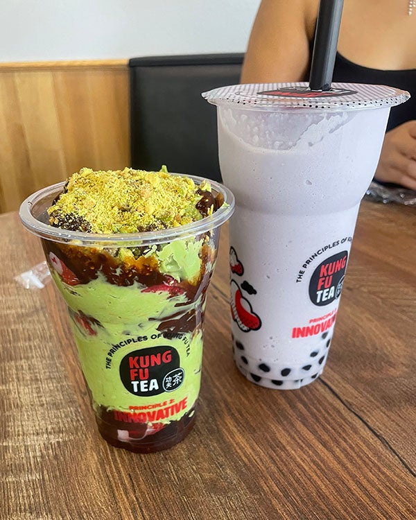 Two green and purple drinks labeled "Kung Fu Tea"