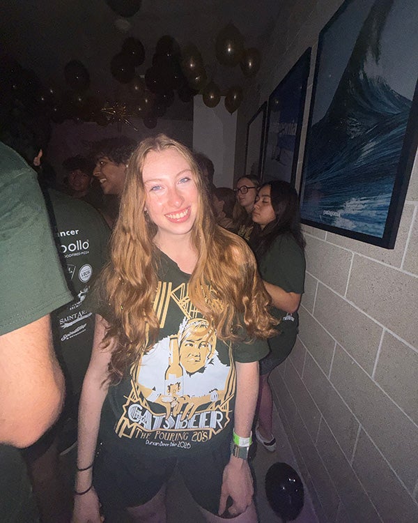 a girl posing in a dark room