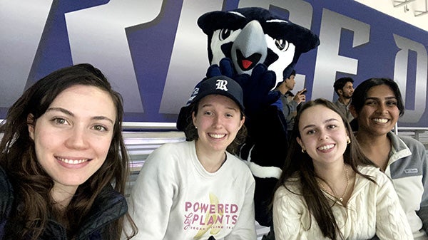 four girls take a selfie with a blue Rice Owls mascot