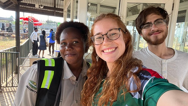A selfie of two girls and a guy