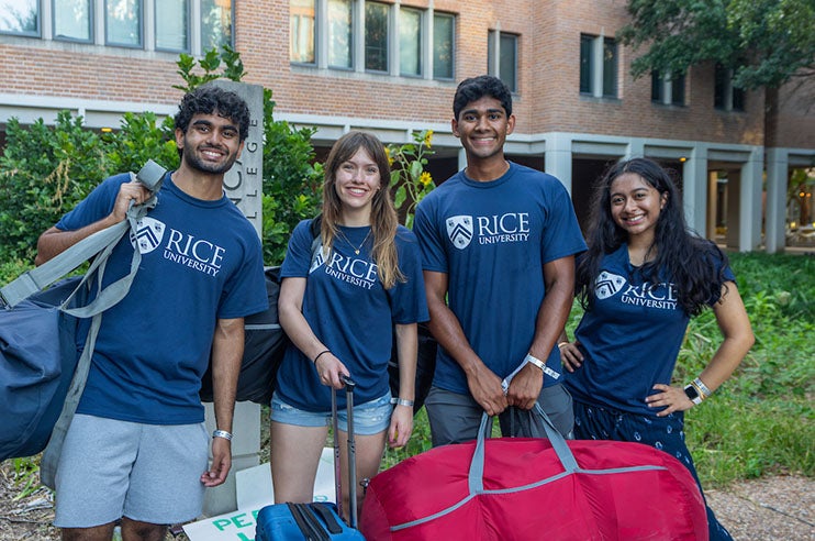 Four students smiling