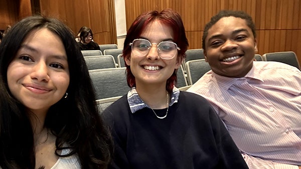 three young adults taking a selfie