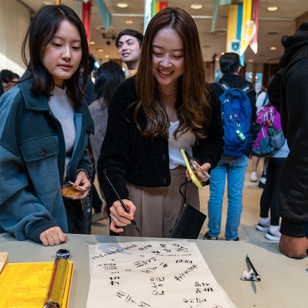 Rice students learn to write their names in Hangul at the Korean Culture Festival