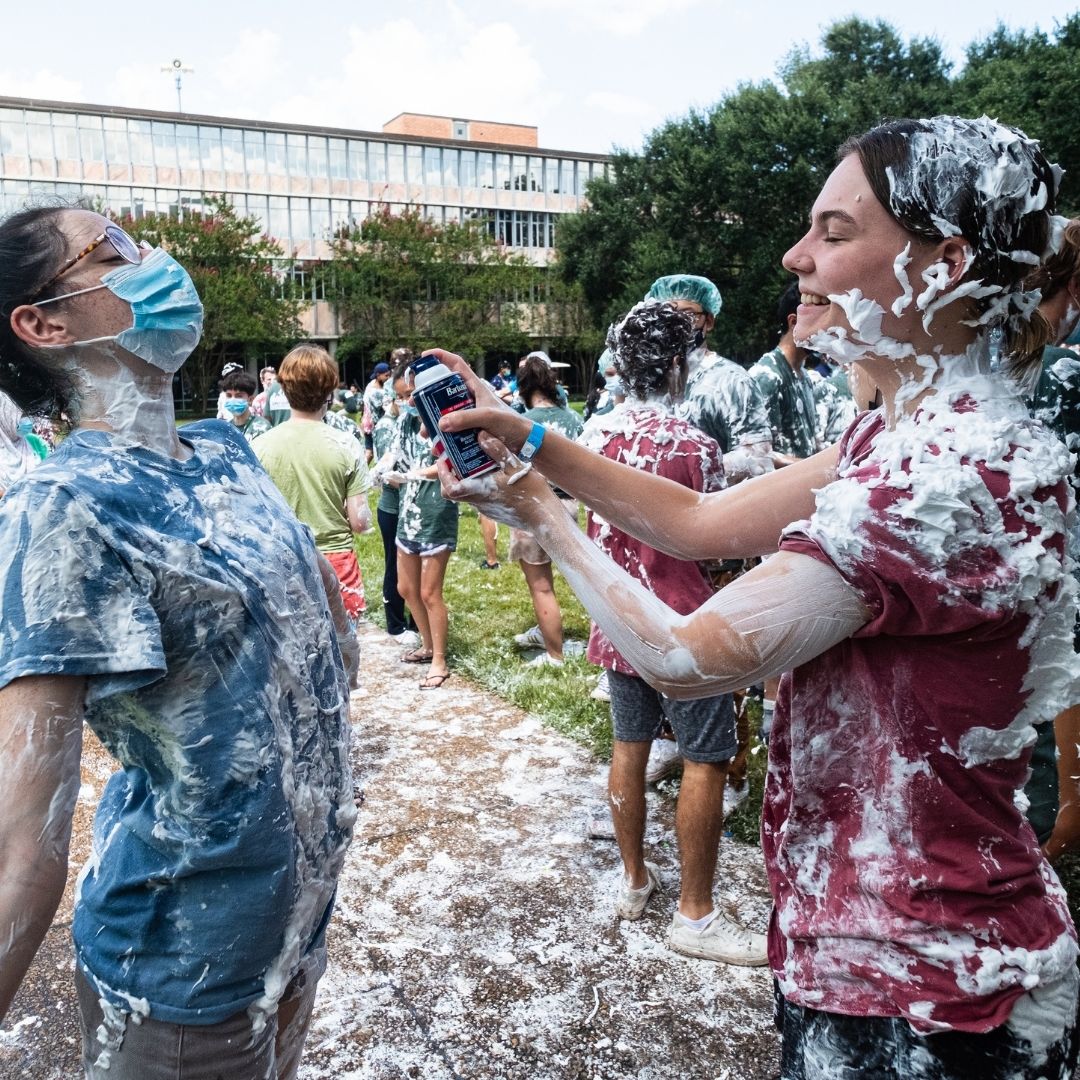 Students outside Jones college covered in shaving cream