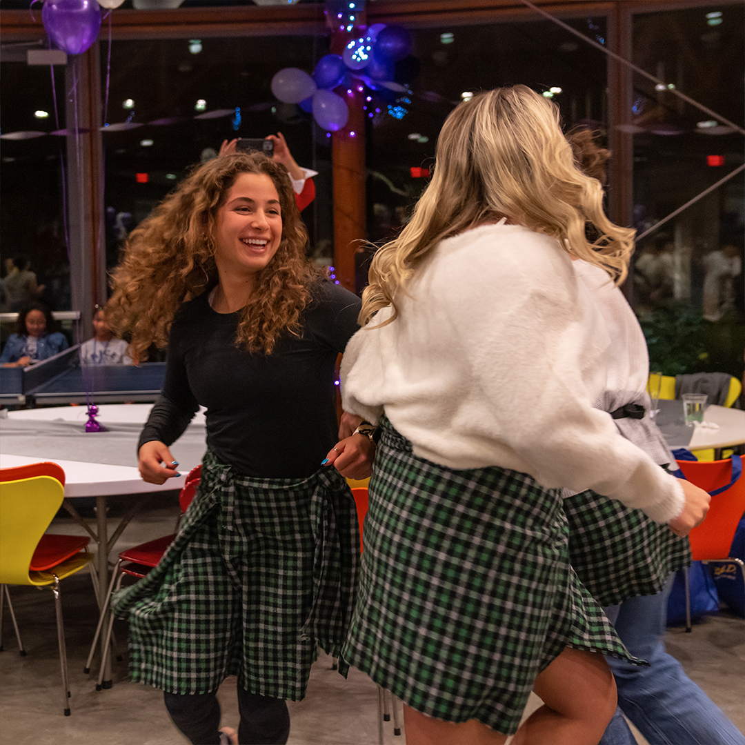 Students of McMurtry College are learning a traditional Scottish dance together during McScottish night, celebrating McMurtry's Scottish Heritage. 