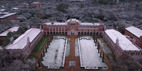 An aerial photo of Lovett Hall and the academic quad lightly dusted with snow.
