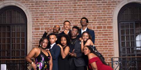 A group of Black Rice students dressed up for the BSA Black Excellence Gala pose with serious and fun faces for a group picture.