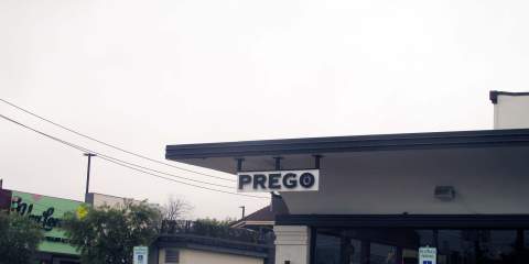  A picture of a restaurant sign that says Prego.