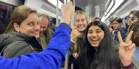 Mariam riding the metro in France with some classmates.