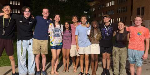 Drenched students posing together