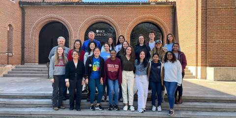 Students standing staggered on stairs