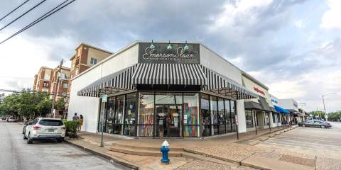 Panoramic view of a corner store with girly, Parisian theming