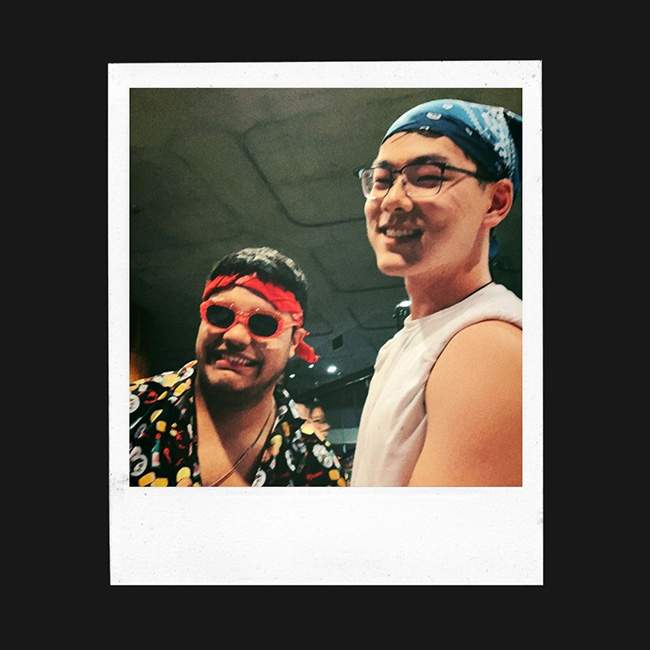 Two male Rice students smile for the camera, and the picture is edited to look like a polaroid.