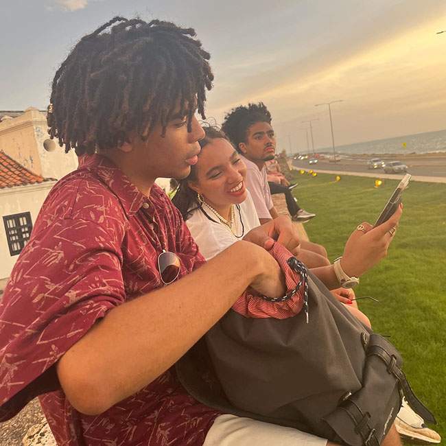 A side profile picture captures Arinze, a Rice student, and other fellow interns in Colombia on an excursion.