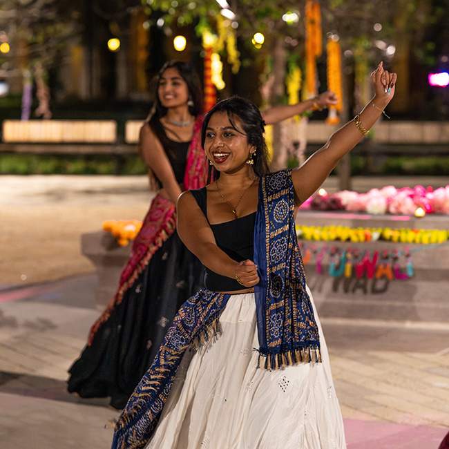 A Rice student wearing a saree and performing a dance during Diwali
