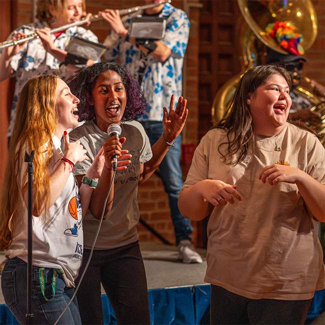 Owls perform to music provided by the Rice MOB (Marching Owl Band).