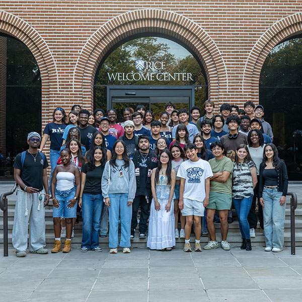 Large group of students standing in front of a building